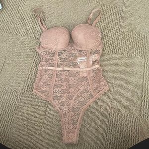 Beige lace body suit. Padded.